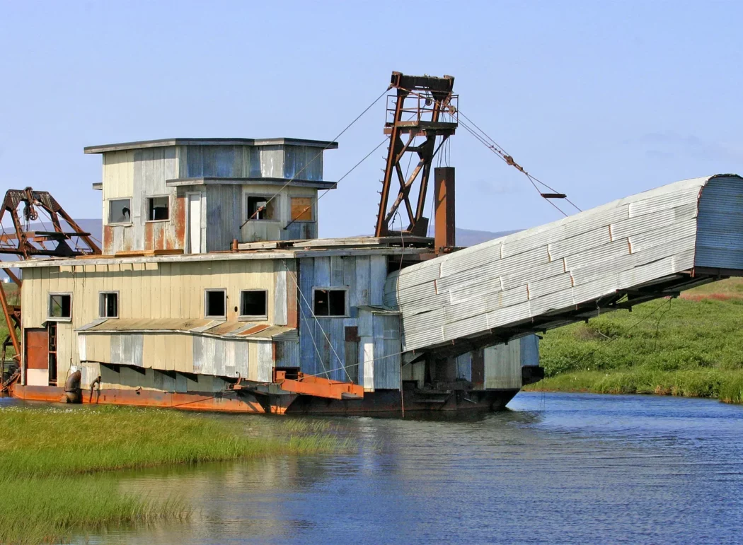 a historic gold dredge in a pond