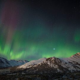 Colorful aurora borealis mountain scenery. (c) Jeff Schultz Photography.