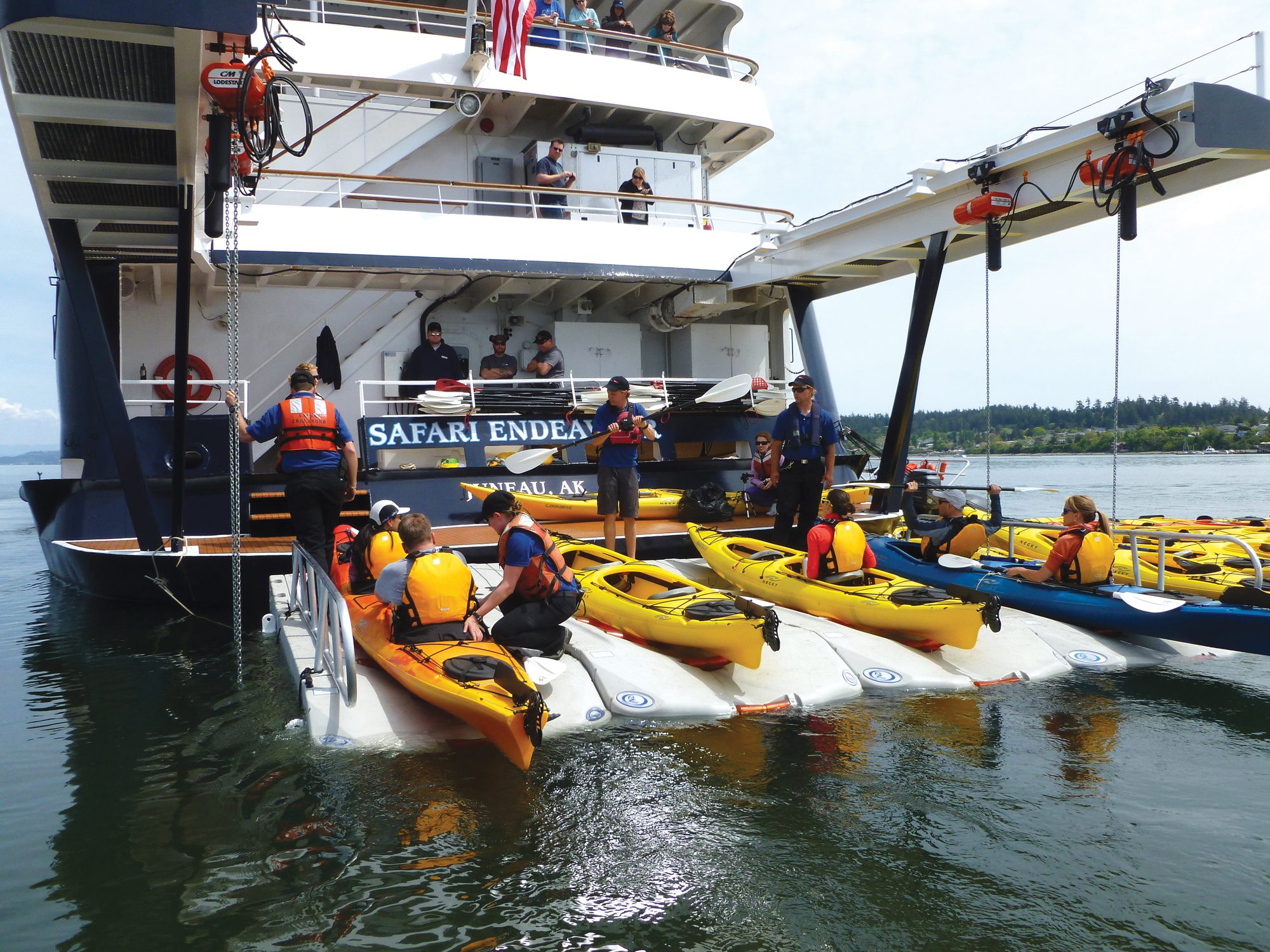 kayakers launching from the stern of the small cruise ship 'Safari Endeavour'