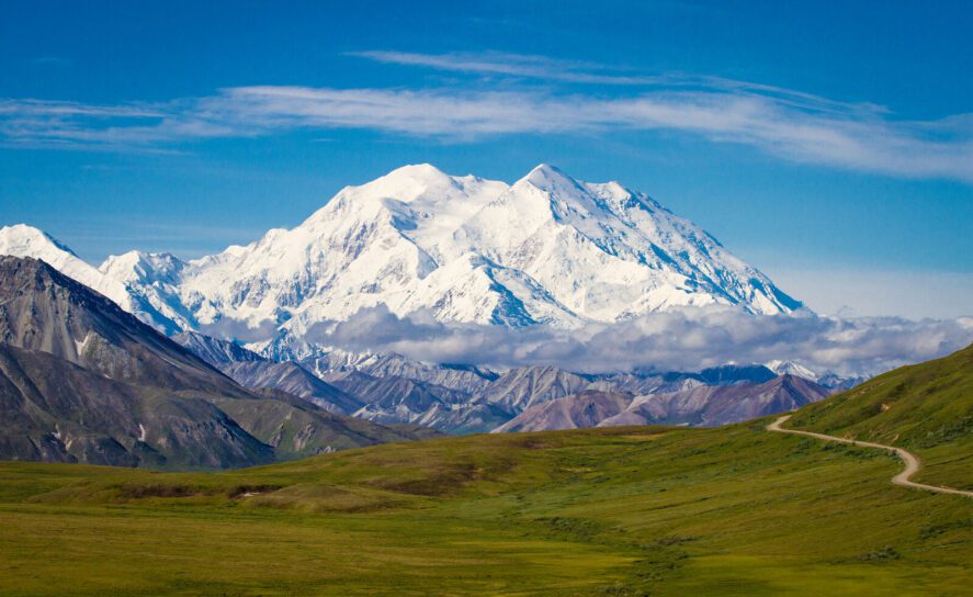 the mountain of Denali; a dirt path in foreground