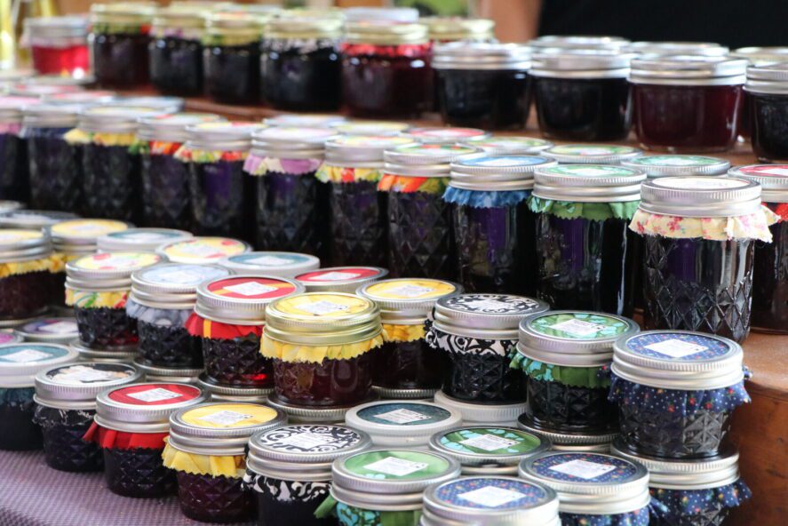 jars of homemade Alaskan preserves at a farmers' market