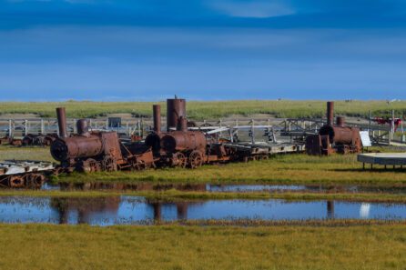 a rusty, abandoned historic train near Nome, Alaska