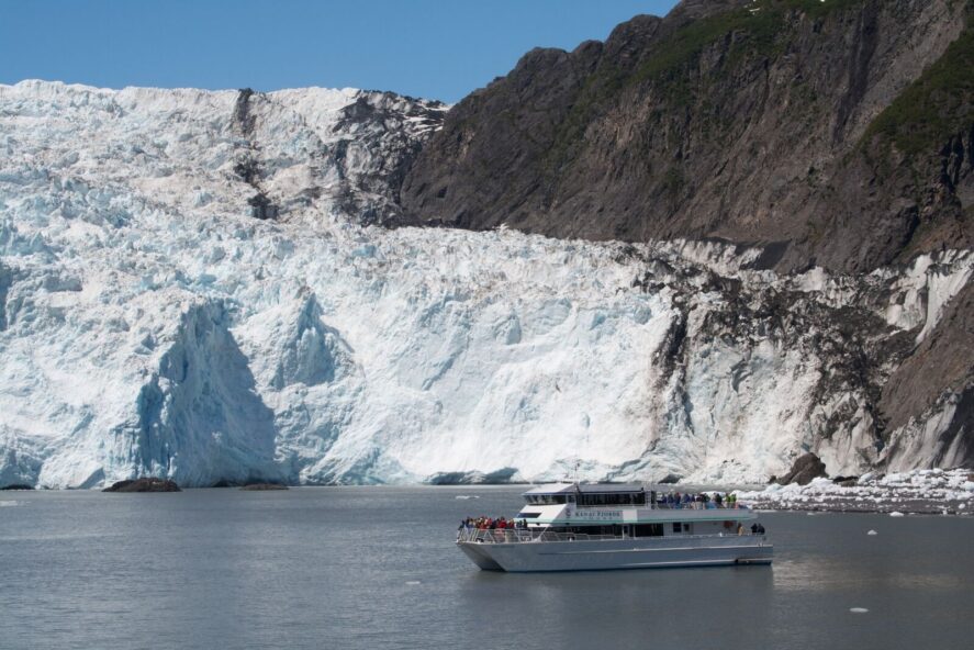 a day-cruise vessel with tourists near the tidewater Holgate Glacier in Kenai Fjords National Park