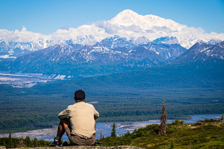 Man views Denali from an overlook