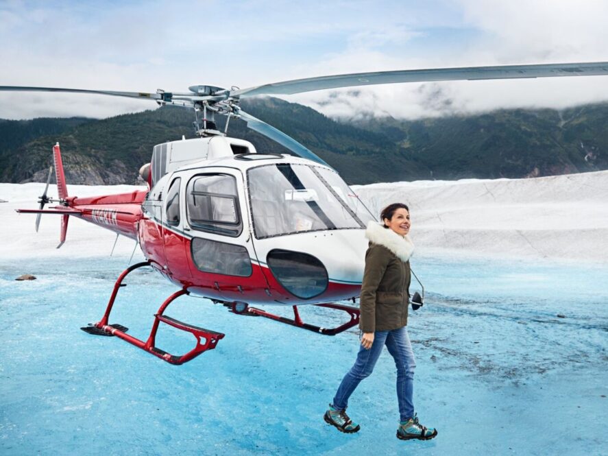 Guest walking Mendenhall Glacier on a Guided Walk on helicopter tour