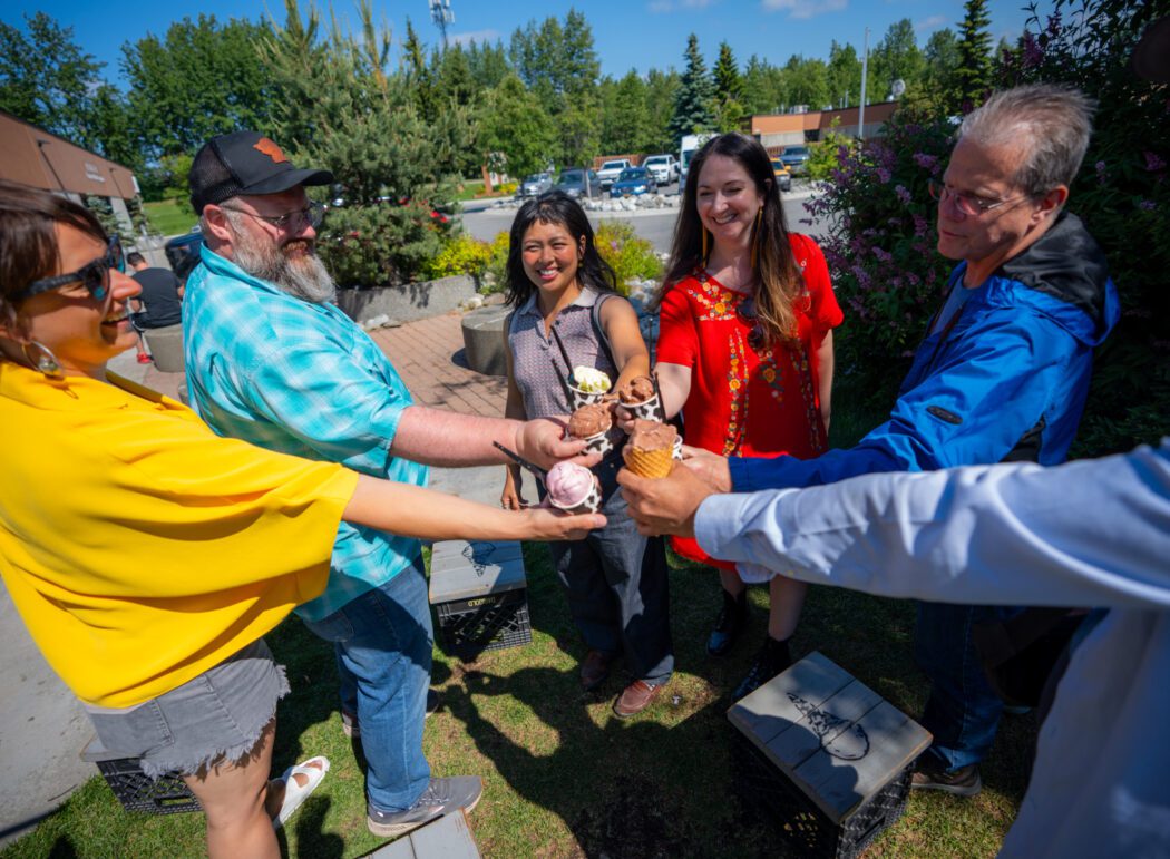 Guests sampling local ice cream during Anchorage food and sightseeing tour.