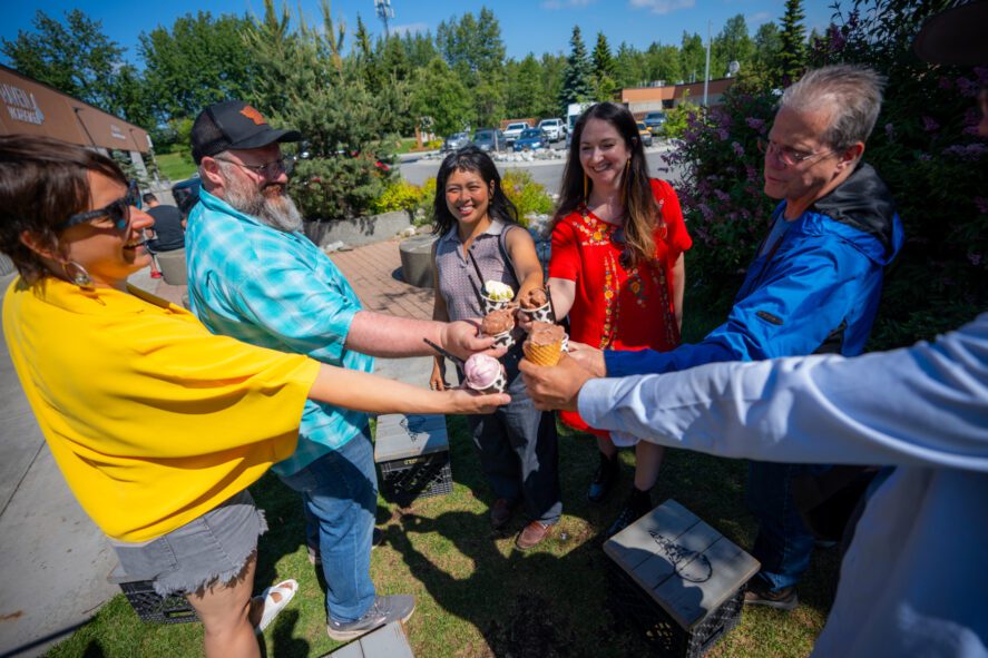 Guests sampling local ice cream during Anchorage food and sightseeing tour.